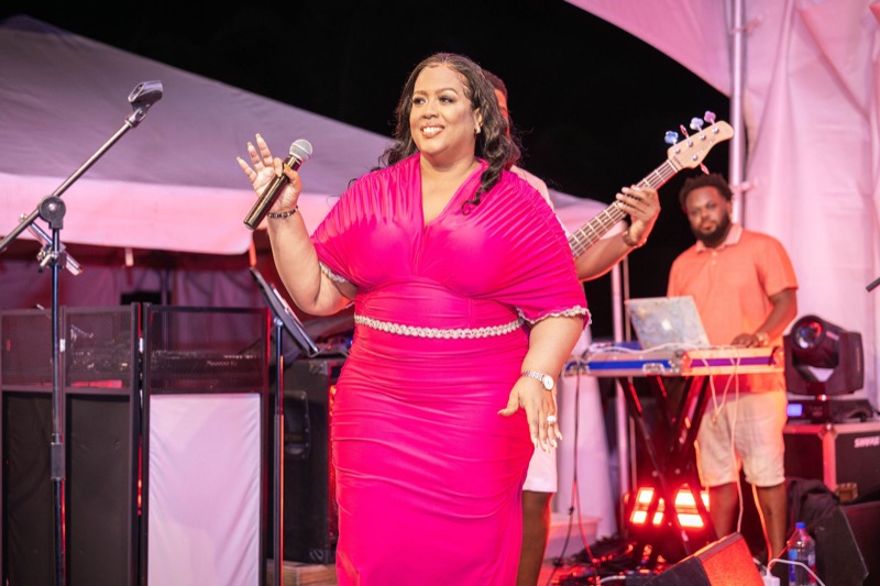 Queen B singing with the band behind her